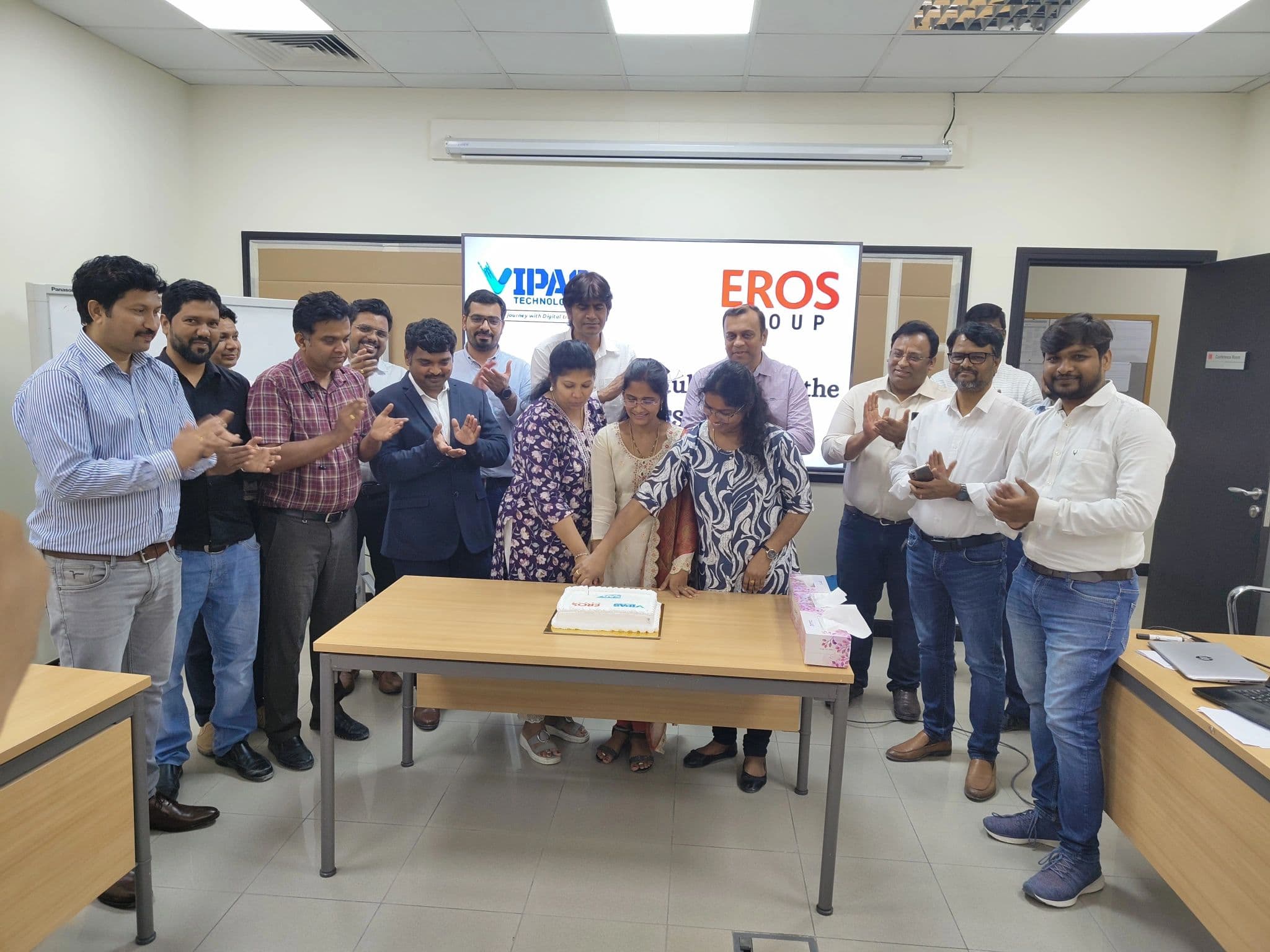 The team cutting a cake to mark a project go-live