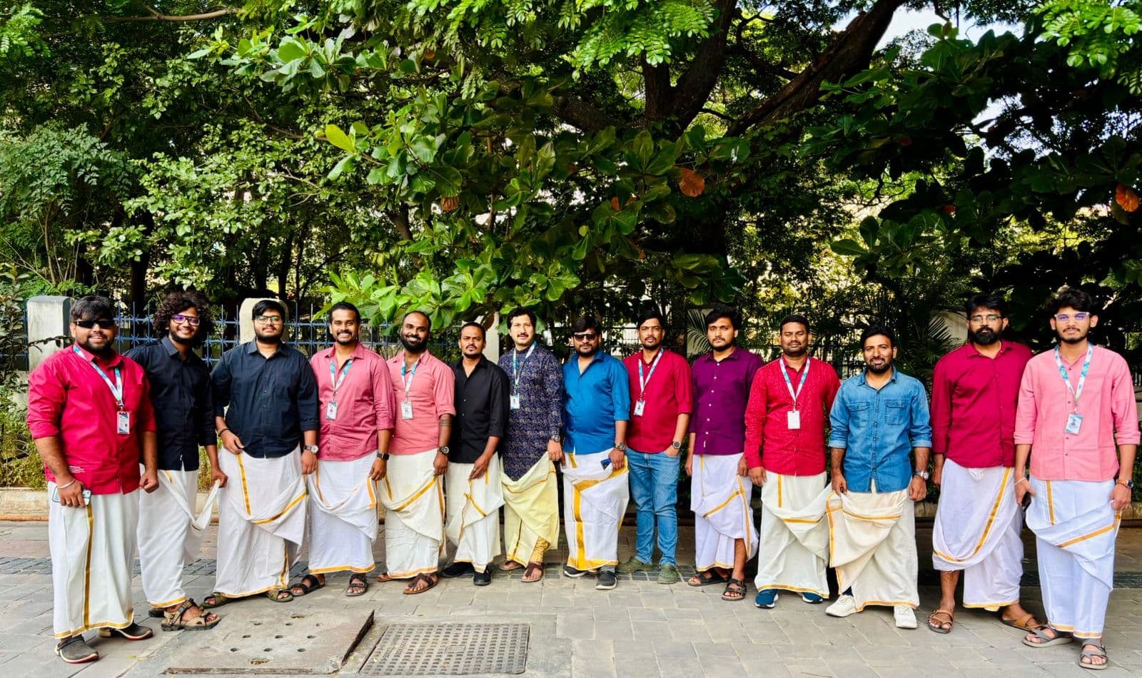 The team dressed in traditional festival attire outdoors