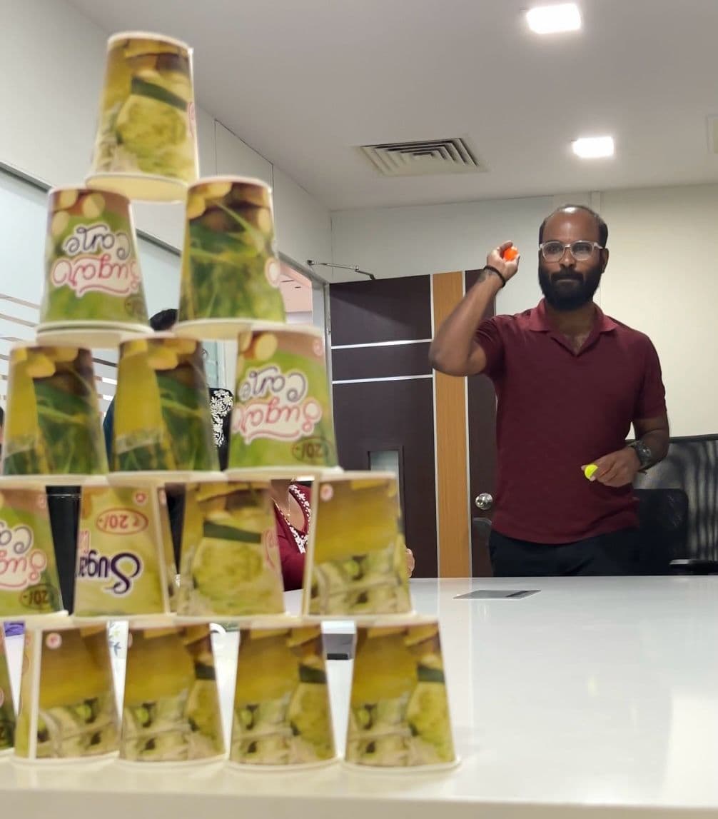 A colleague concentrating on the office cup game